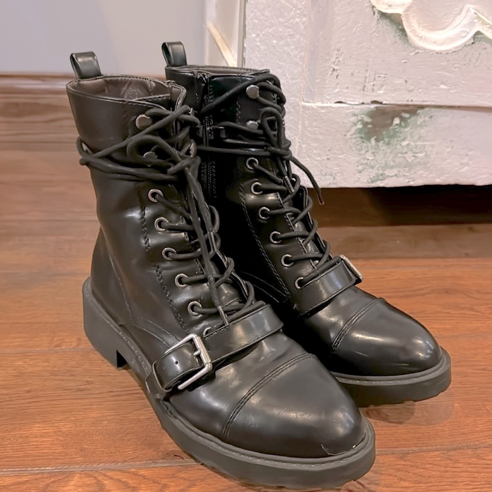 Black combat boots with buckle, tie and Zip. All man made material